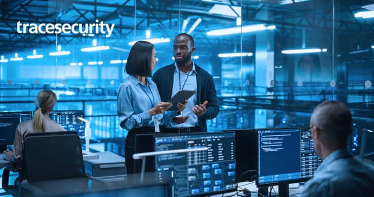 Business professionals discussing cybersecurity strategies in a high-tech office.